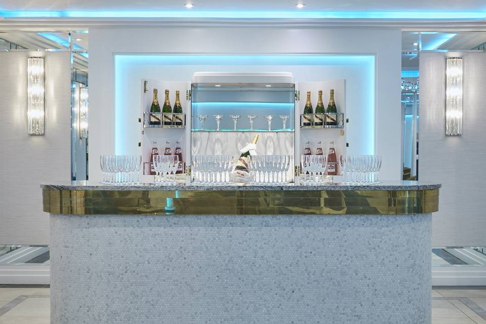 Malone Suite marble bar with ambient lighting for upscale networking and VIP reception events.