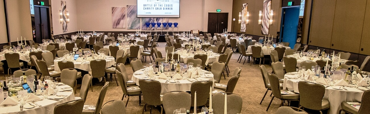 Ballroom gala setup with stage at Hilton Southampton, ideal for professional corporate events.