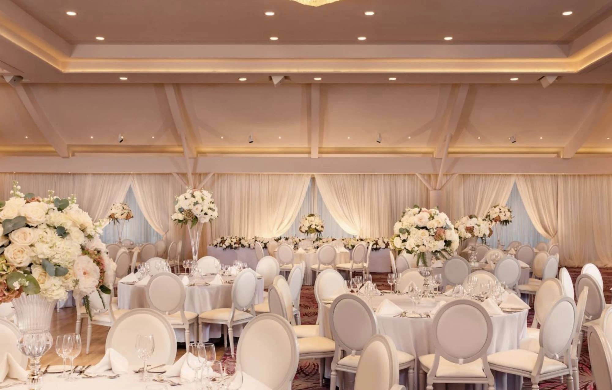 Grand Ballroom at Stormont Hotel with elegant floral centerpieces for weddings and corporate galas.