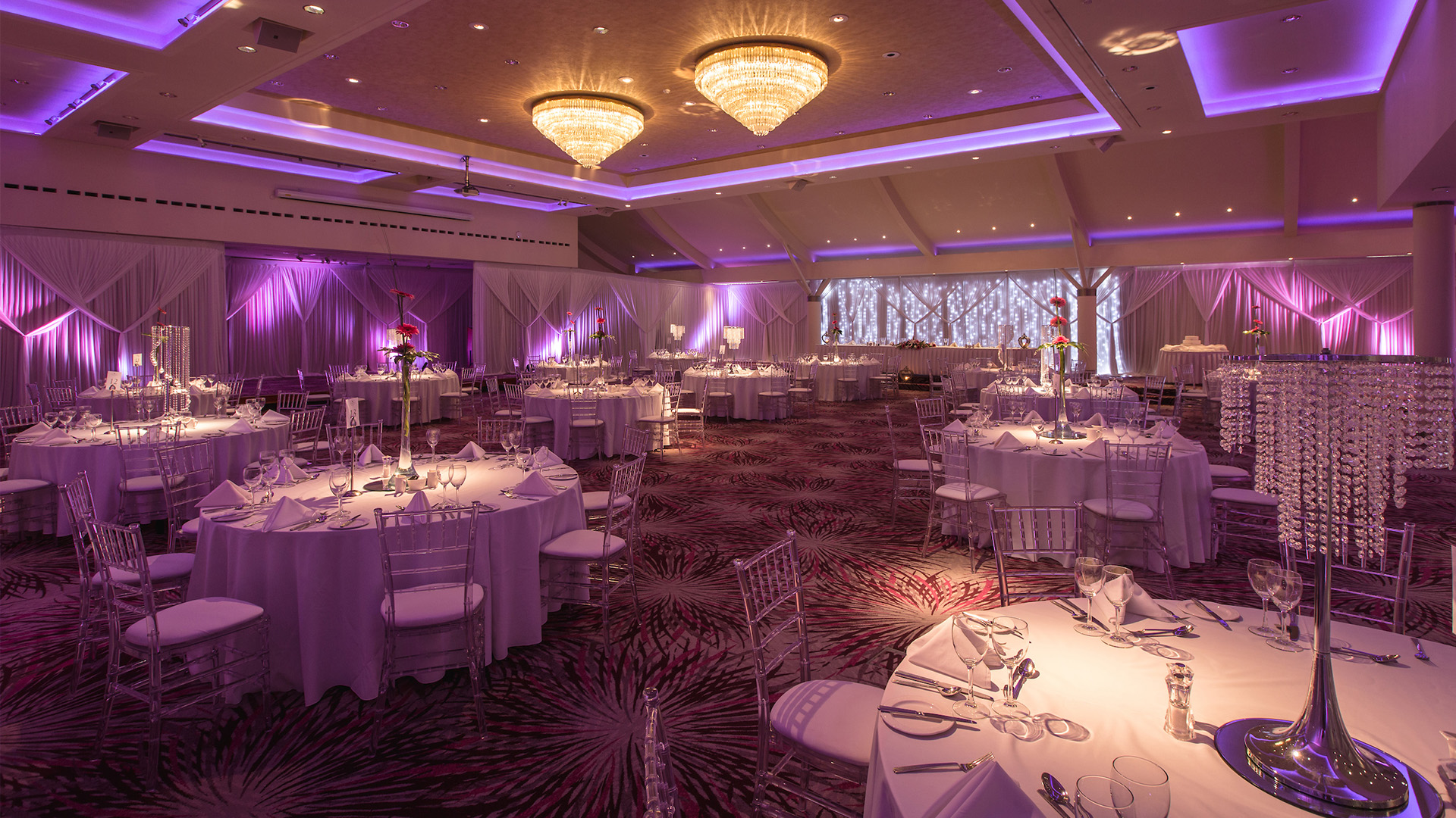 Grand Ballroom at Stormont Hotel: gala setup with purple lighting for weddings and corporate events.