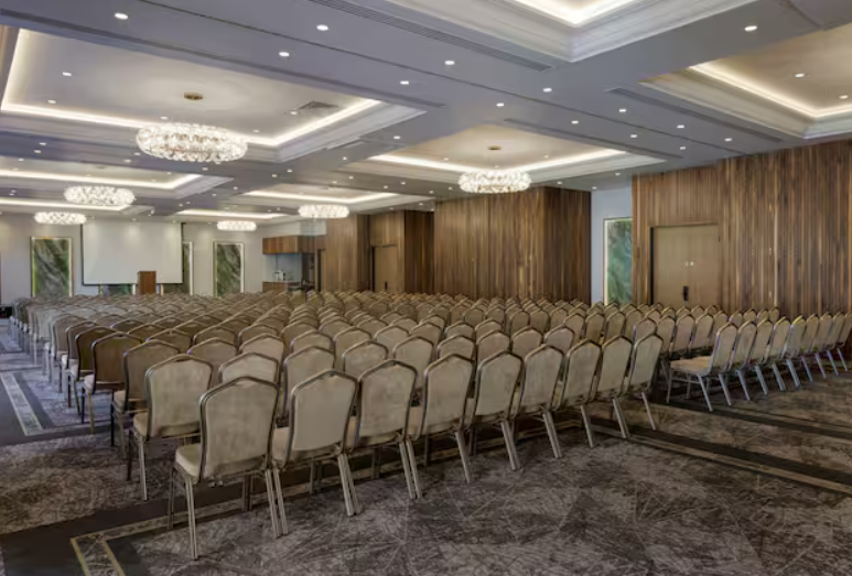 Kingfisher Suite ballroom, theater-style seating, corporate event space, business conference venue.