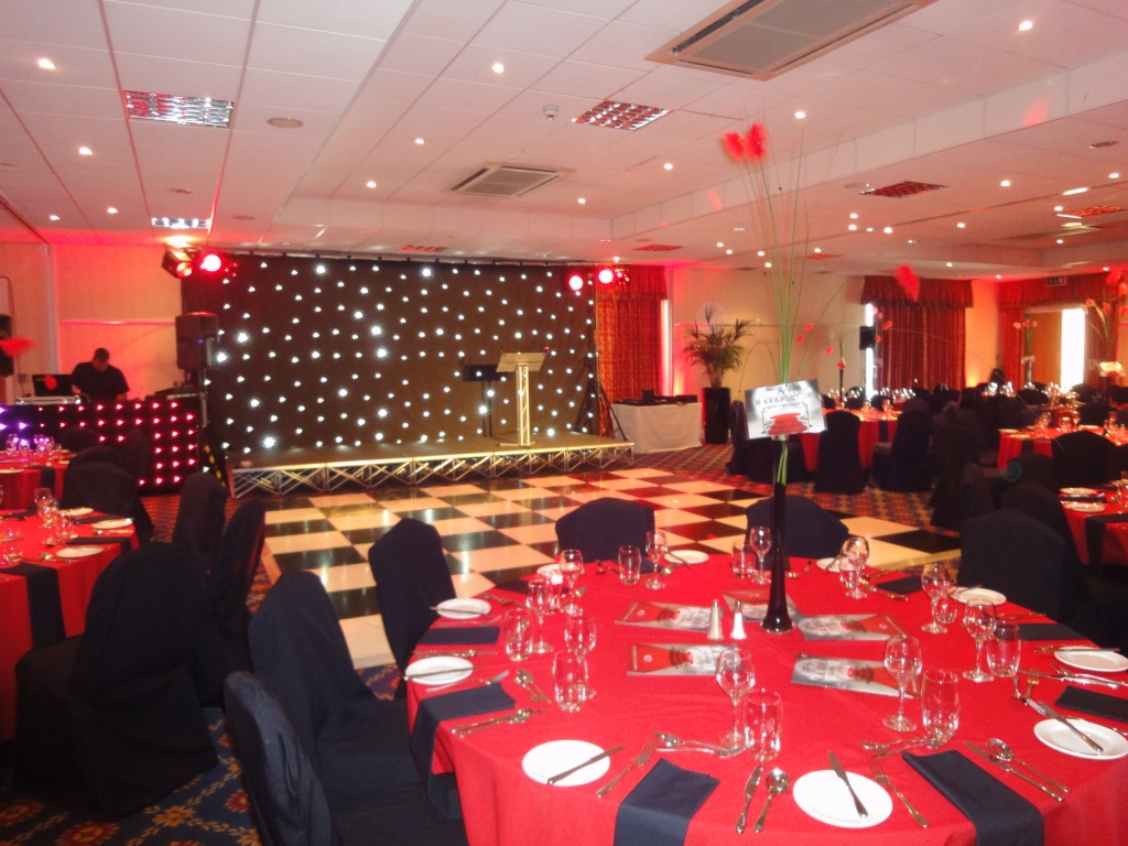 Stephenson Suite gala dinner with red and black decor, starlit backdrop and dance floor.