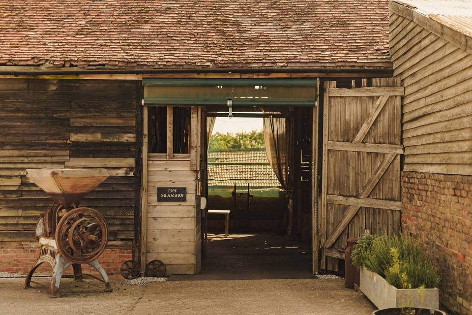 The Granary at Lodge Farm: rustic event venue entrance for farm-to-table weddings and conferences.