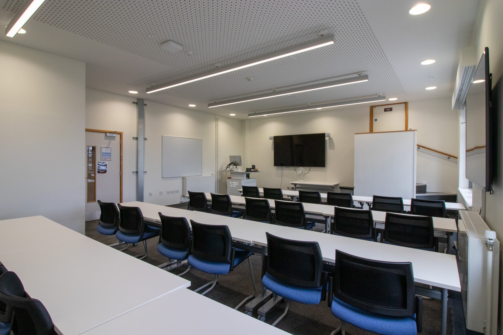 Main Training Room with AV setup for corporate workshops and professional educational sessions.