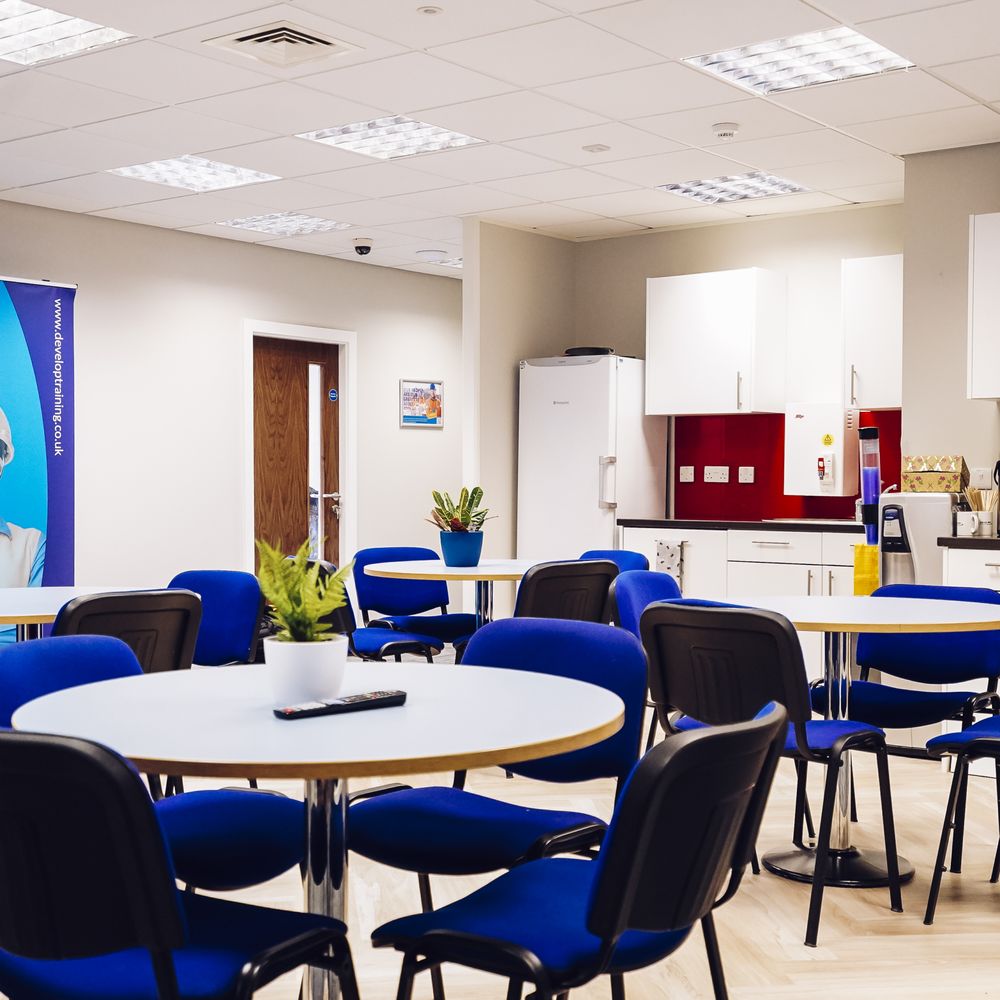 Main Training Room with dense table layout, ideal for corporate workshops and team meetings.