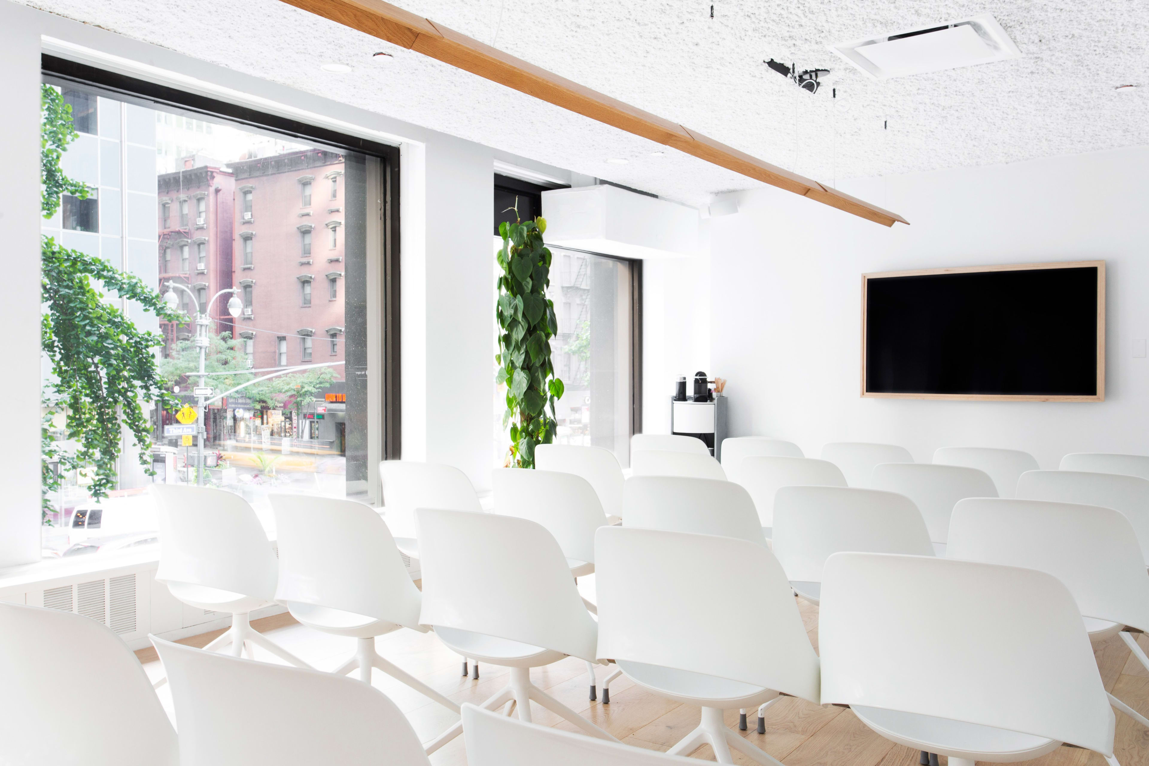 Theater-style breakout area for corporate presentations and training workshops.