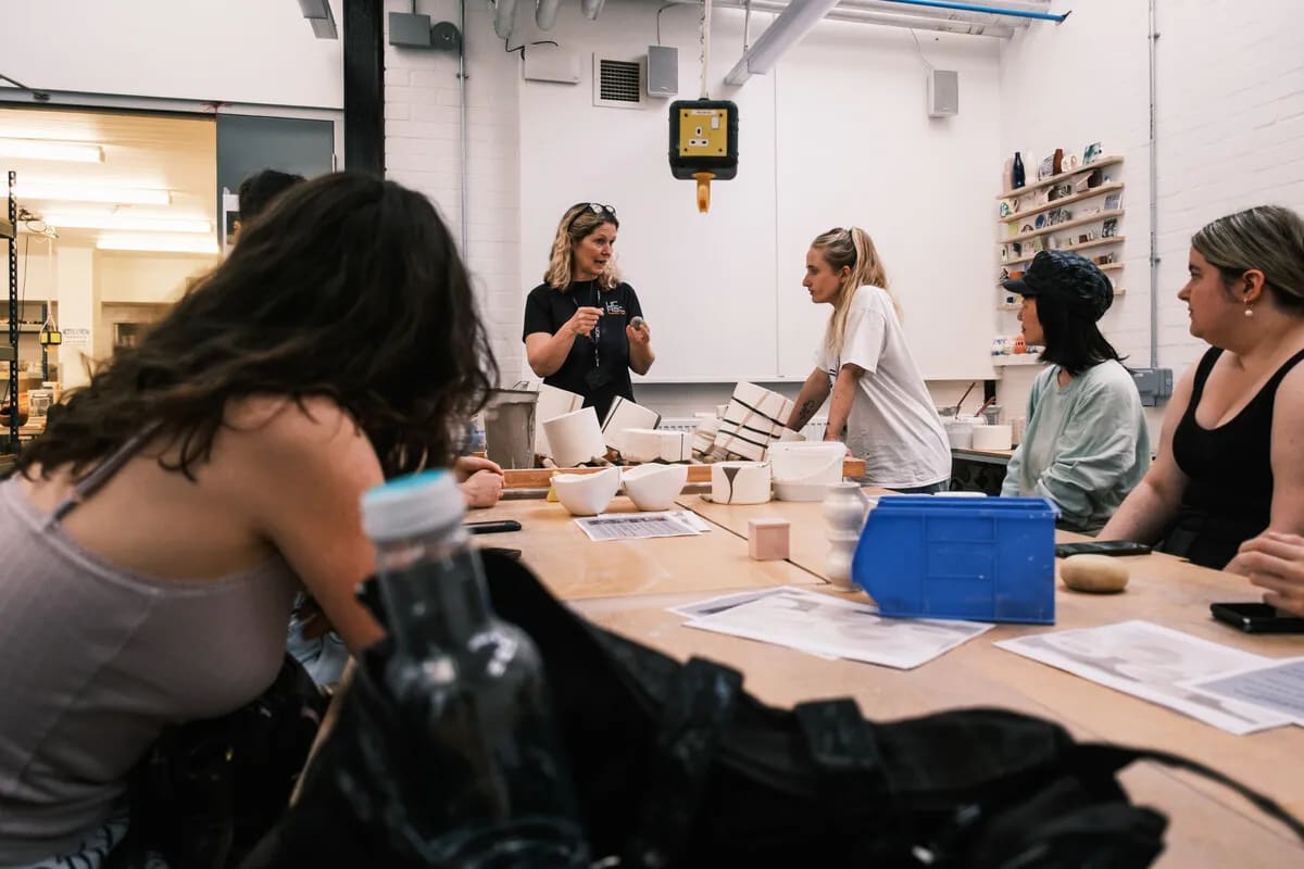 Lampworking workshop in industrial studio for creative corporate team building events.