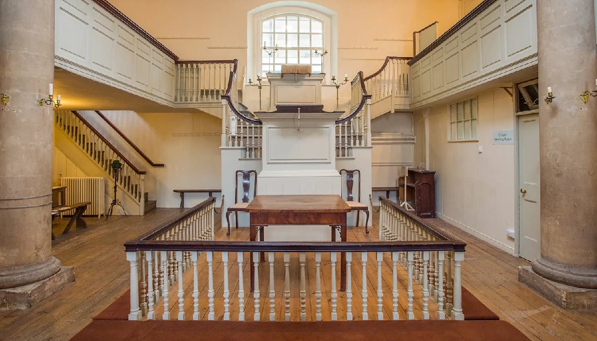 Historic 18th Century Chapel with fixed seating for intimate event venue hire.