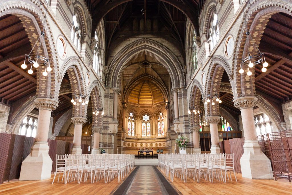 Main Hall at St Stephen's Hampstead: Gothic wedding and presentation venue with symmetrical layout.