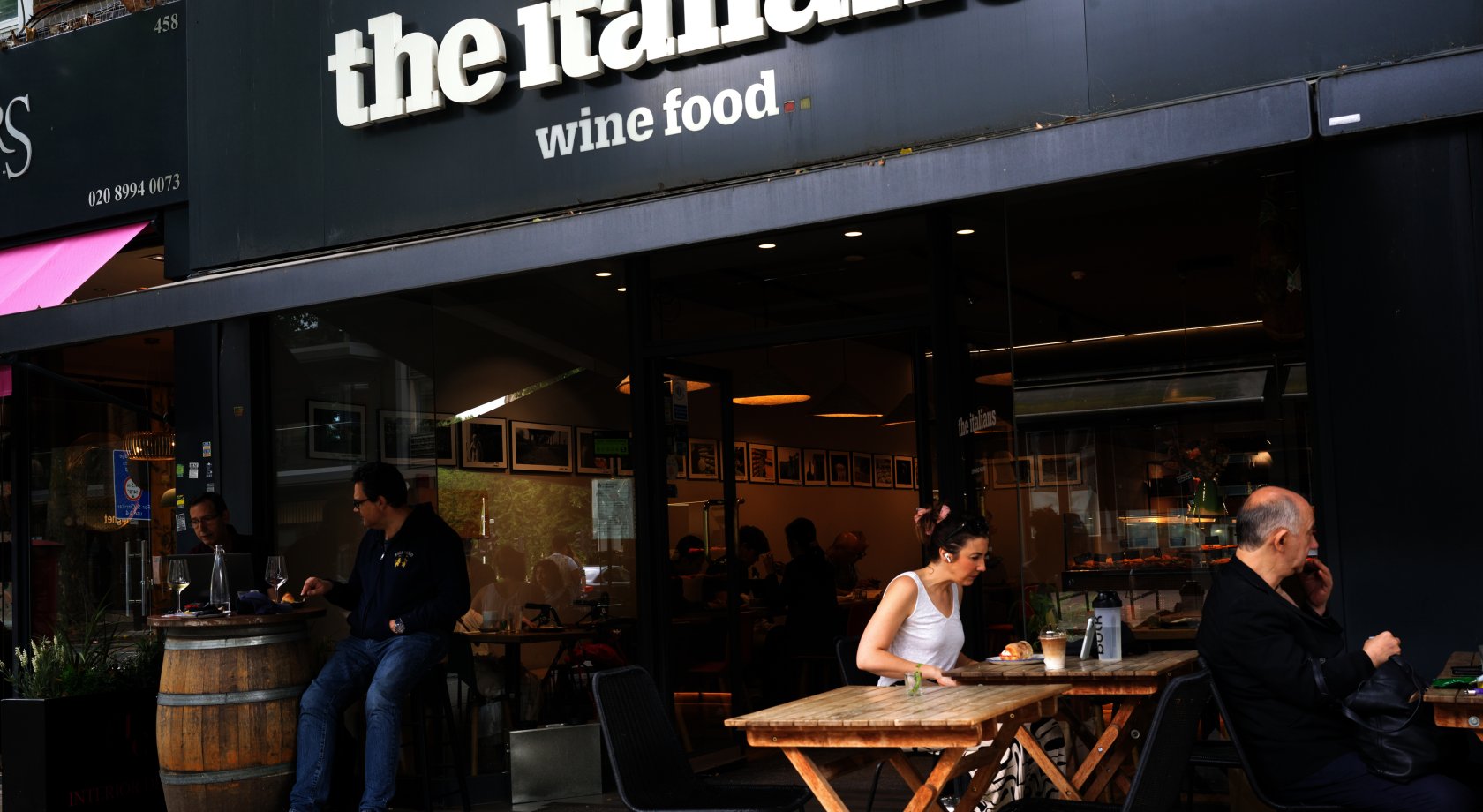 Wine bar patio with barrel seating for professional networking mixers and corporate events.