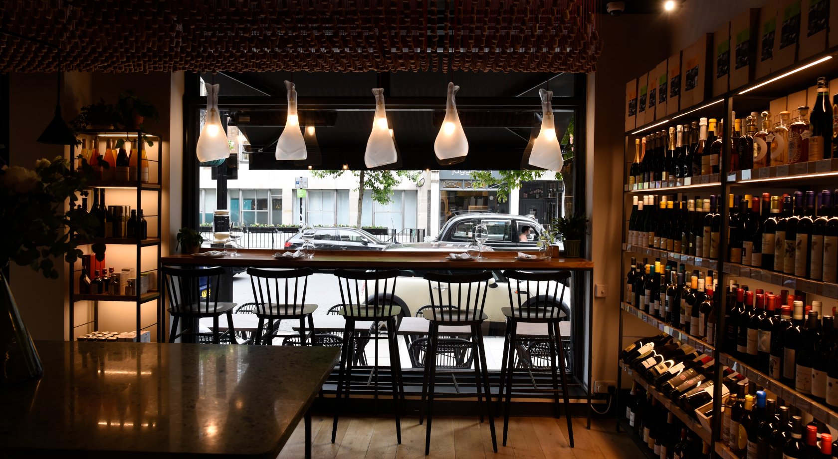 Modern-industrial wine bar for upscale networking and boutique wine tasting events.