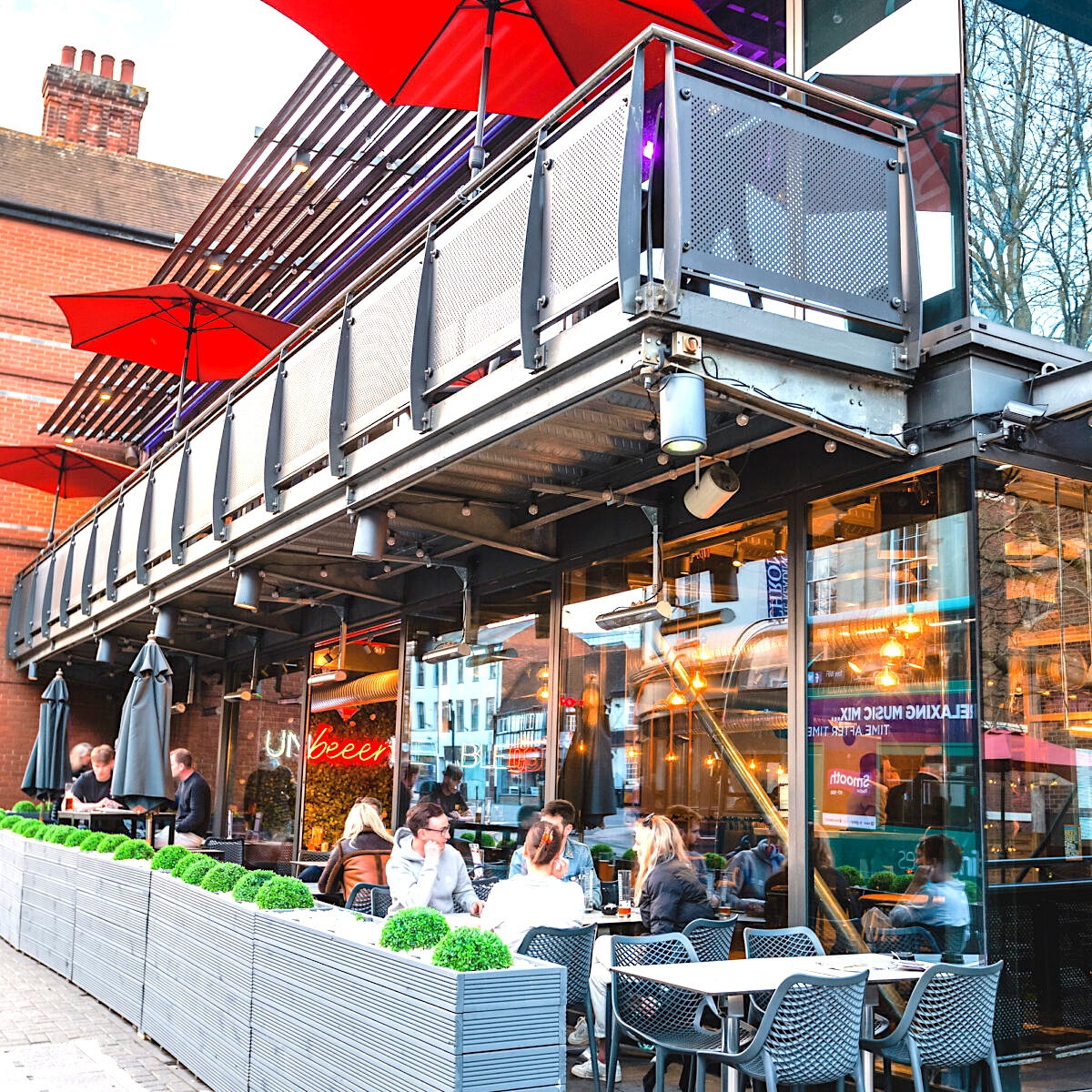 Industrial-chic Tank Lounge at Zerodegrees with retractable roof for corporate happy hour events.