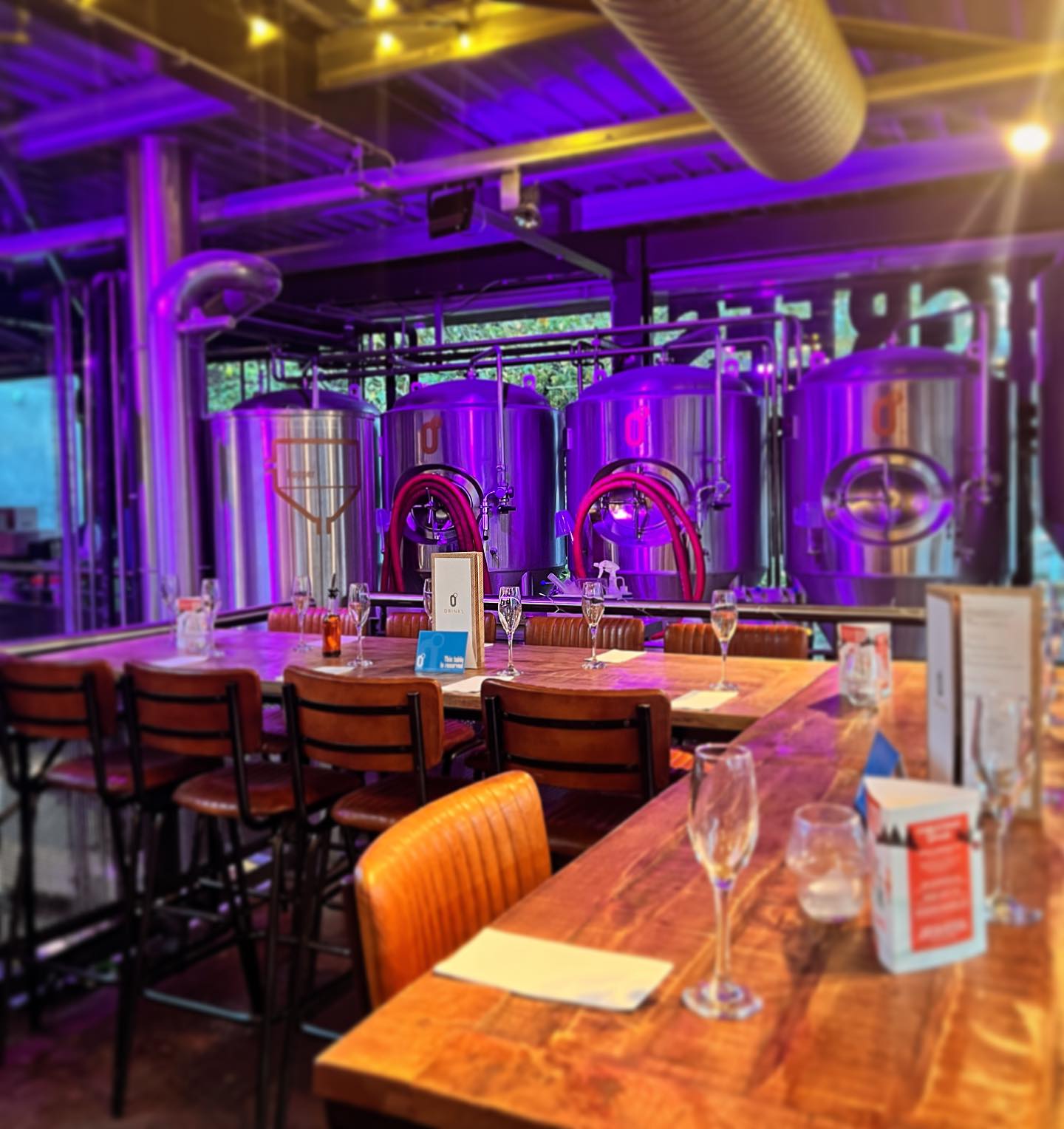 Tank Lounge industrial event space with stainless steel fermenters for corporate receptions.