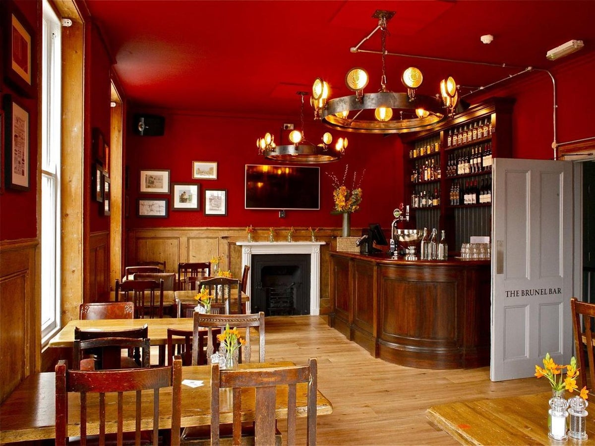 Rustic Brunel Bar venue for networking events and private workshops with warm atmospheric lighting.