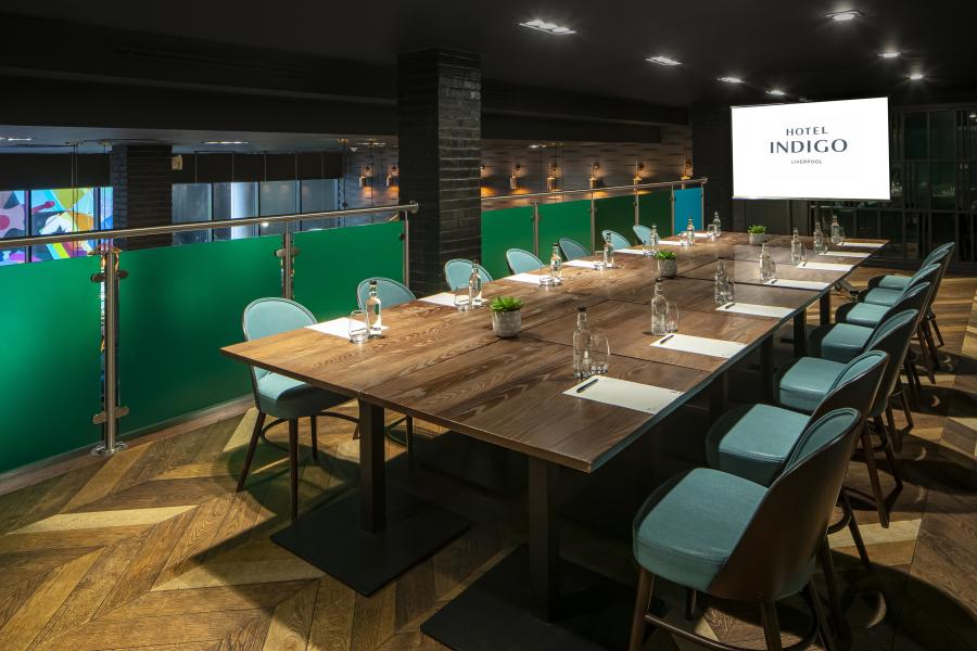 Boutique boardroom at Hotel Indigo Liverpool with industrial decor for creative meetings.