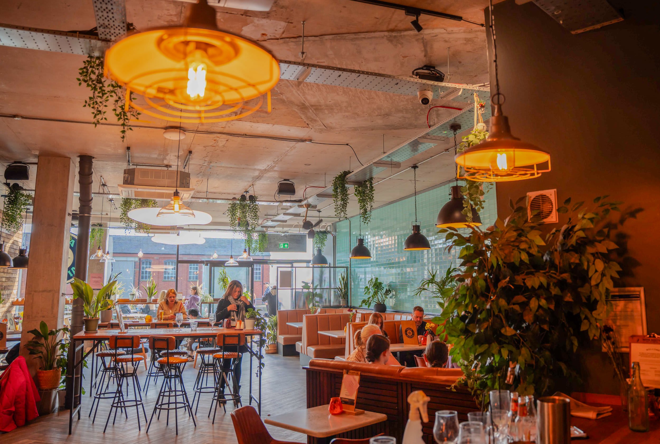 Industrial-chic BOXPARK Liverpool venue with varied seating for workshops and networking events.