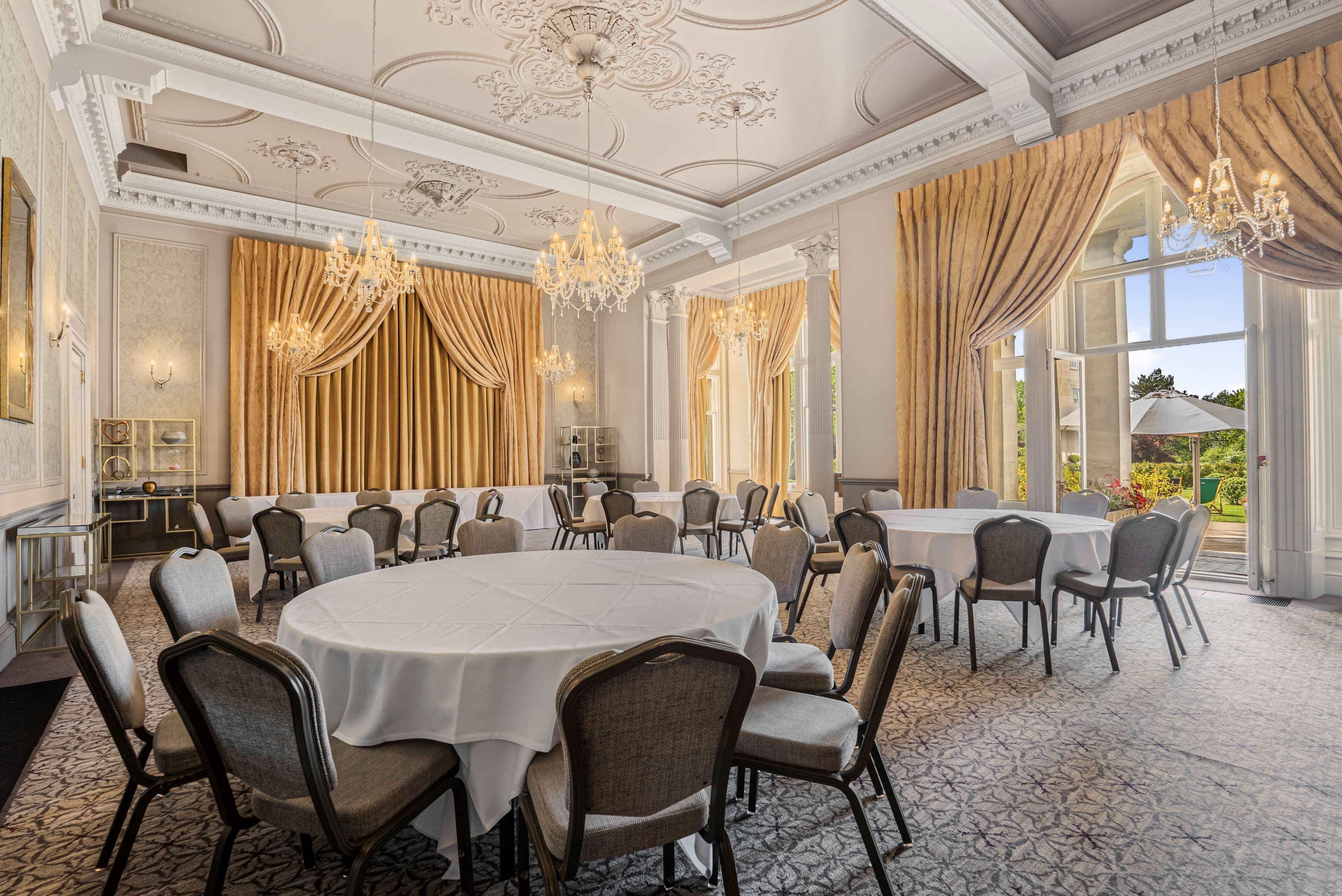 Chichester Suite banquet hall with crystal chandeliers for luxury weddings and corporate events.