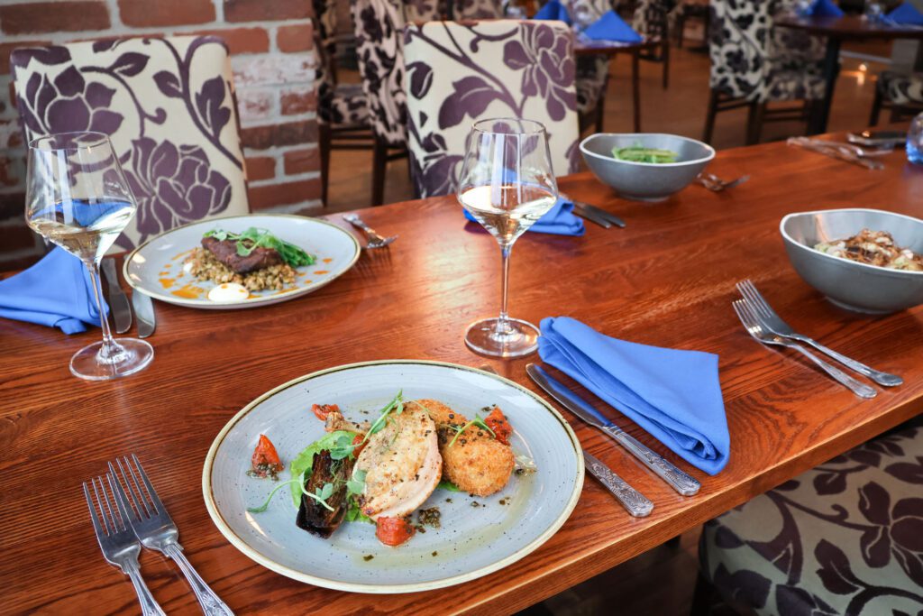 Rustic Stable Inn event space with blue linens for executive dinners and networking meals.