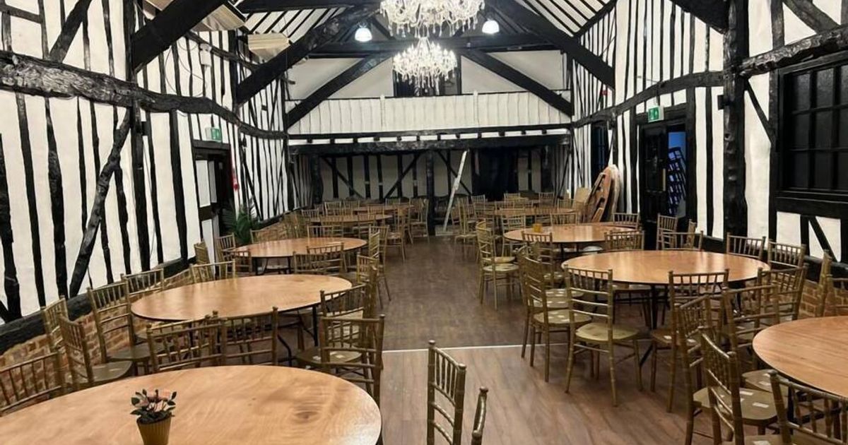 Rustic-chic banquet hall with timber beams for wedding and event venue rentals.