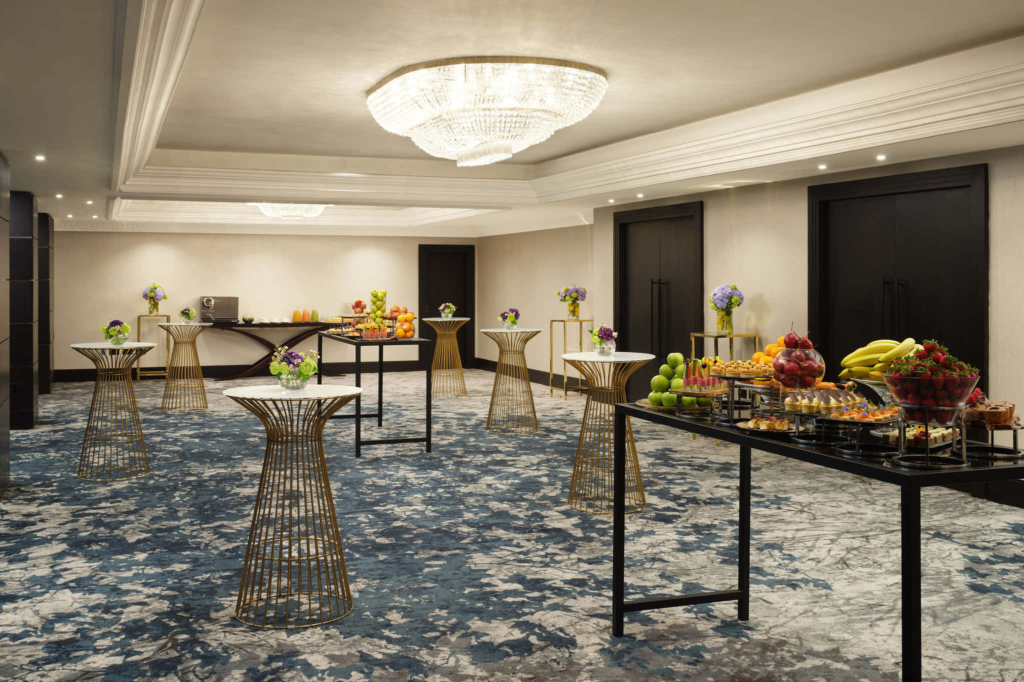 Elegant cocktail tables and buffet in Palais Ballroom for corporate networking and events.
