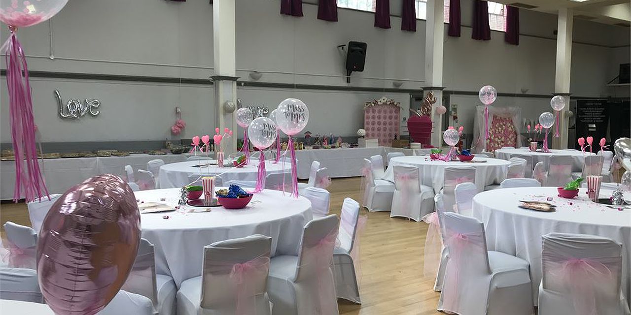 Pink-themed banquet hall set for a wedding reception or social event at Crofton Halls Main Hall.