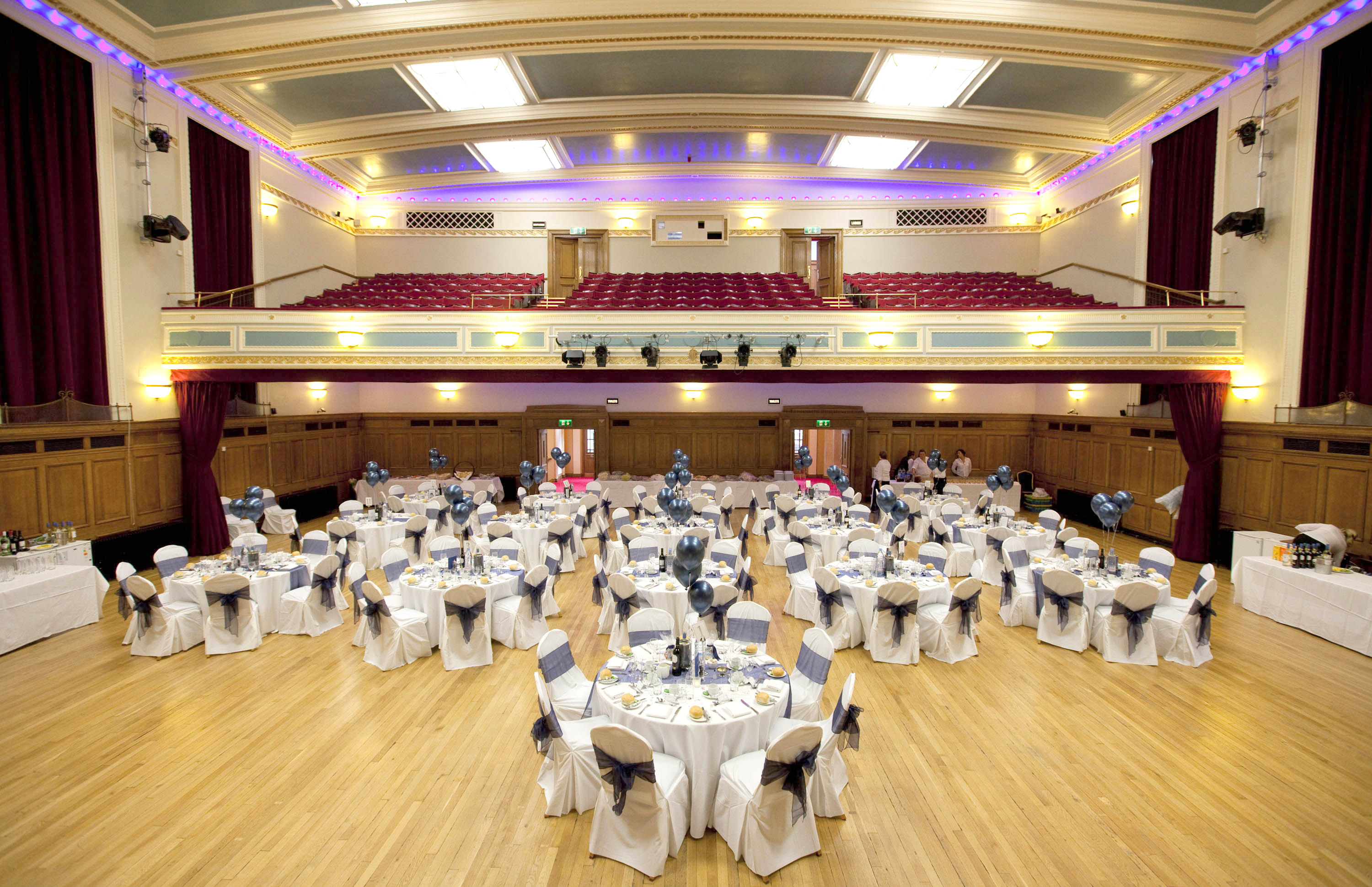 Main Hall gala dinner event space with tiered balcony for corporate events and weddings.