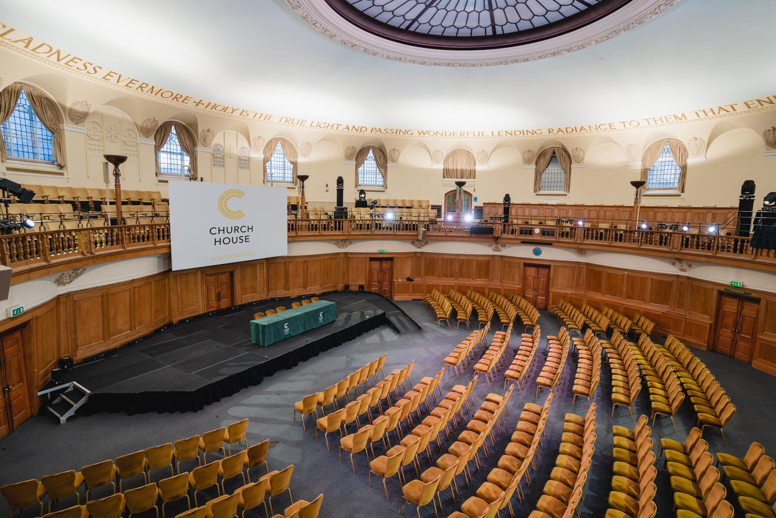 Main Hall tiered auditorium with stage for keynote presentations and corporate events.