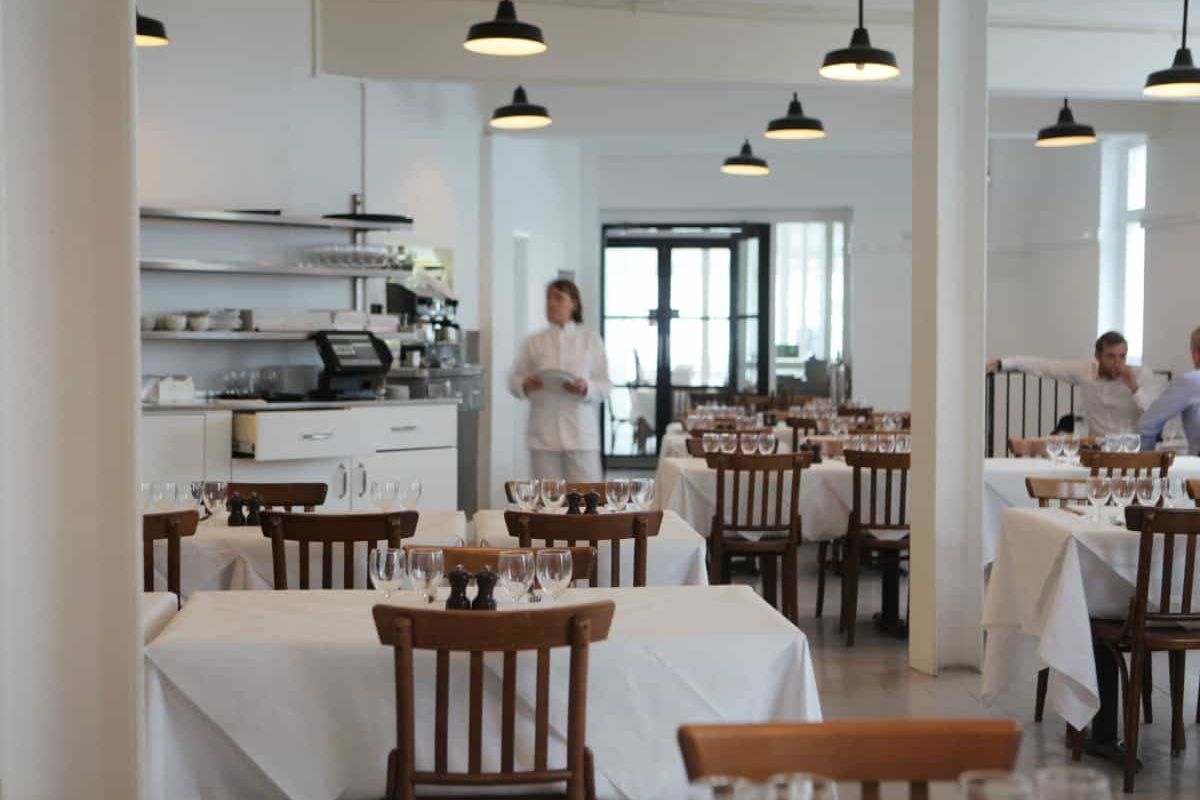 Exclusive Use dining at St. JOHN Bread & Wine, featuring white-linen corporate event venue.