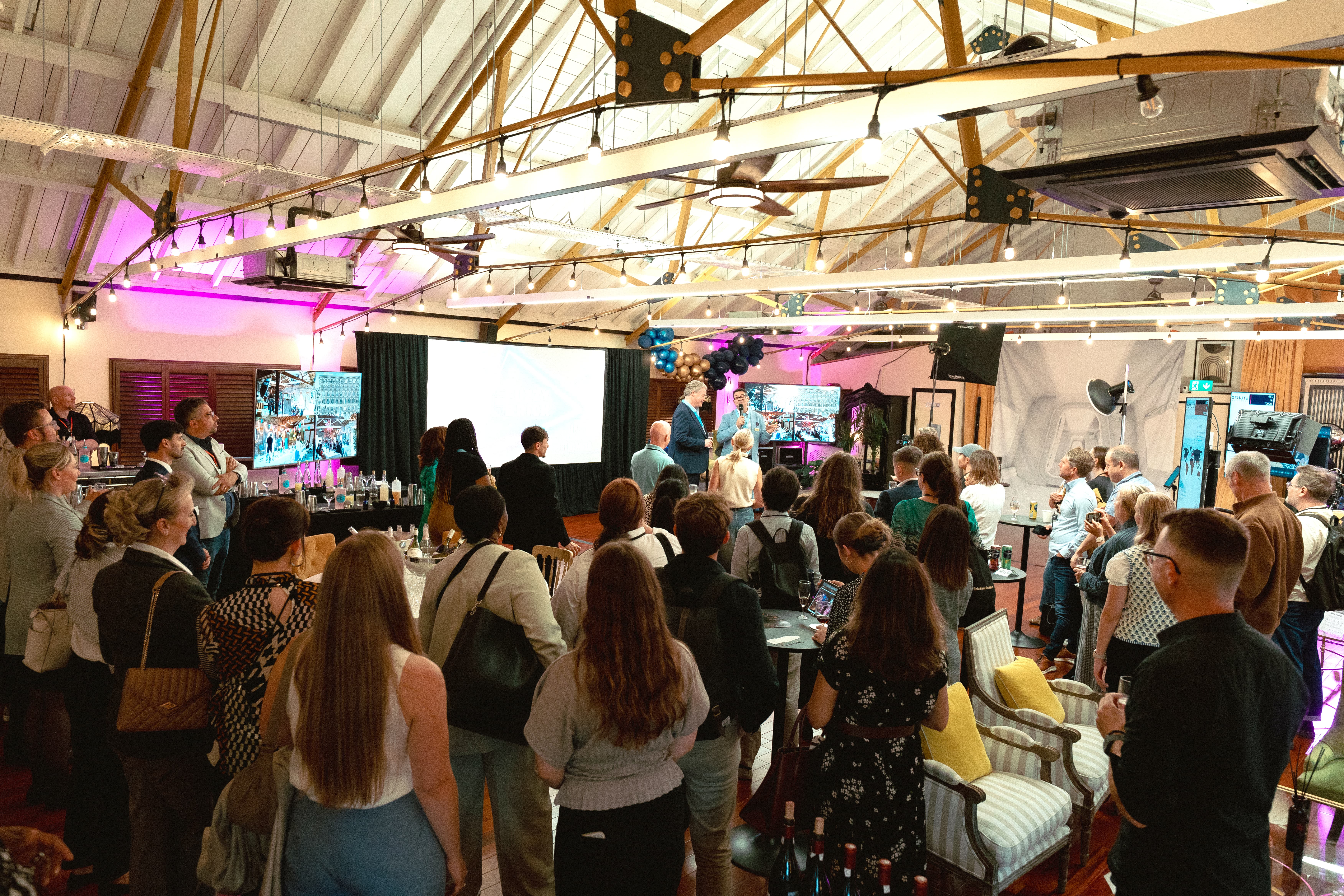 Underwood Lofts industrial warehouse networking event with ambient lighting.