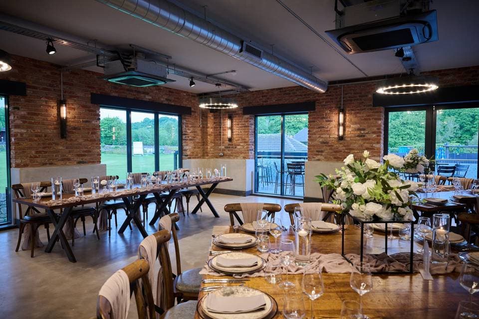 Tollgate Suite at The Hurt Arms: Industrial-chic venue for banquet dining and corporate events.
