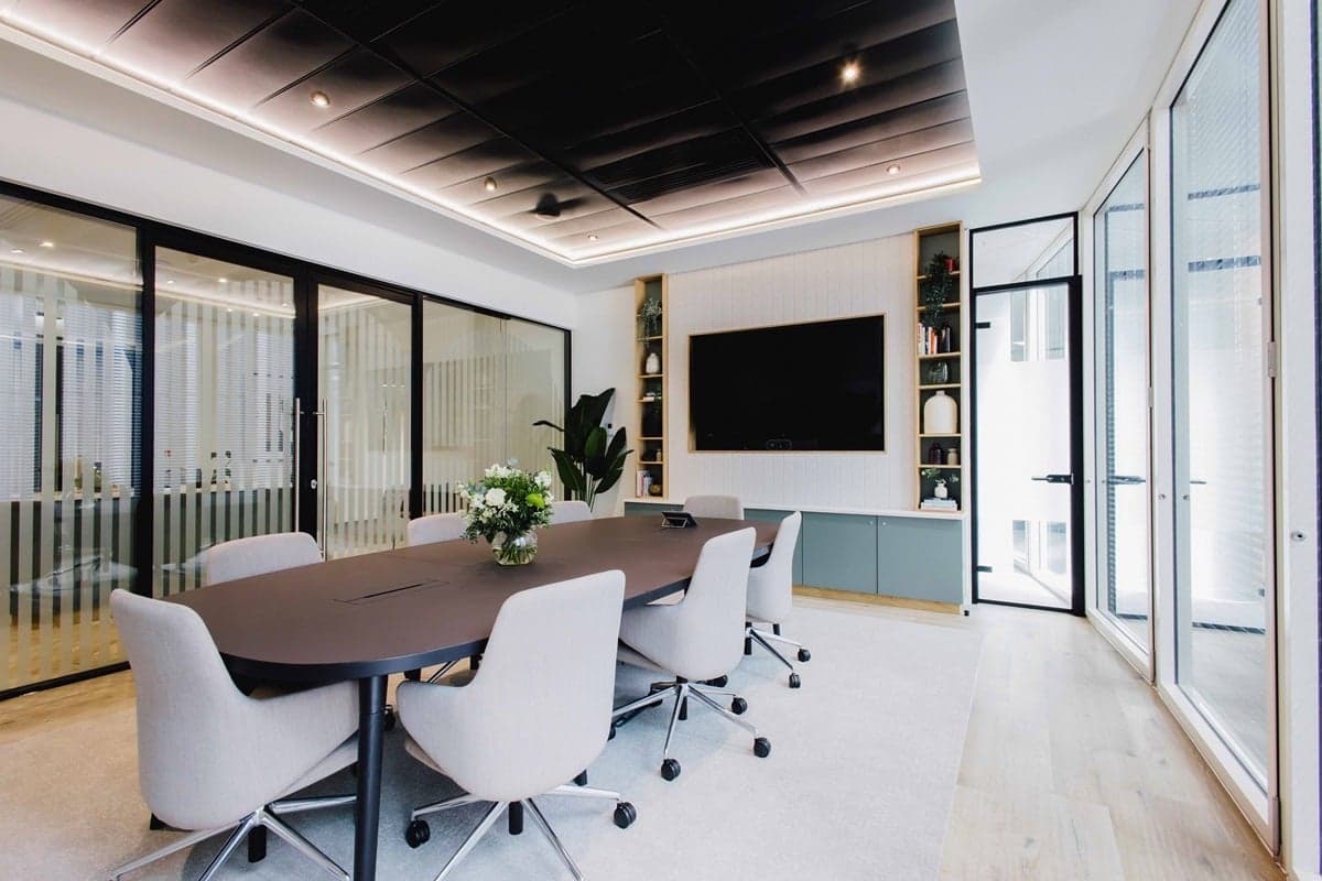 Modern Barbican Centre boardroom with oval table for executive meetings and hybrid conferences.