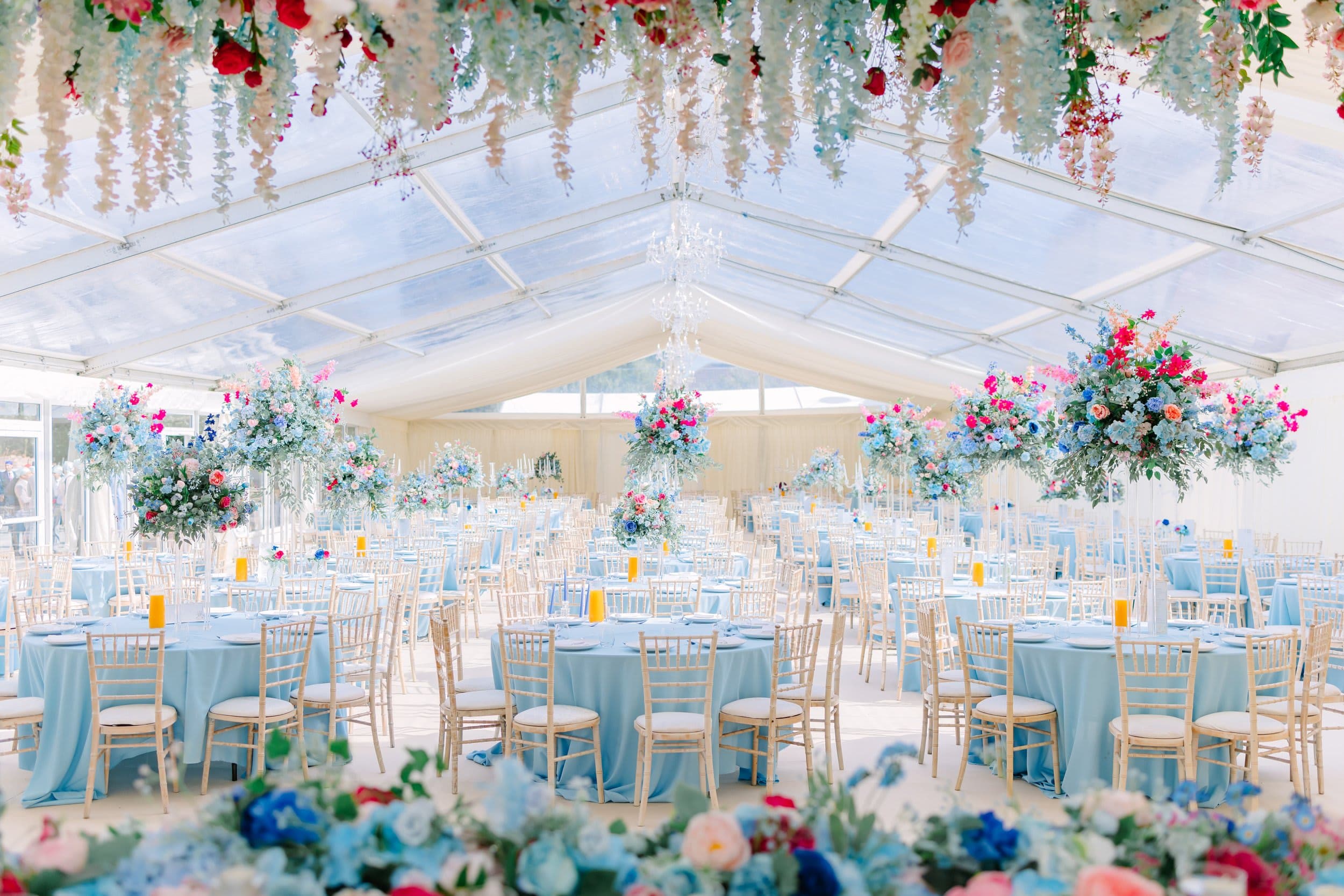 Clear-span marquee at Nottingham Castle with floral decor for luxury wedding or corporate event.