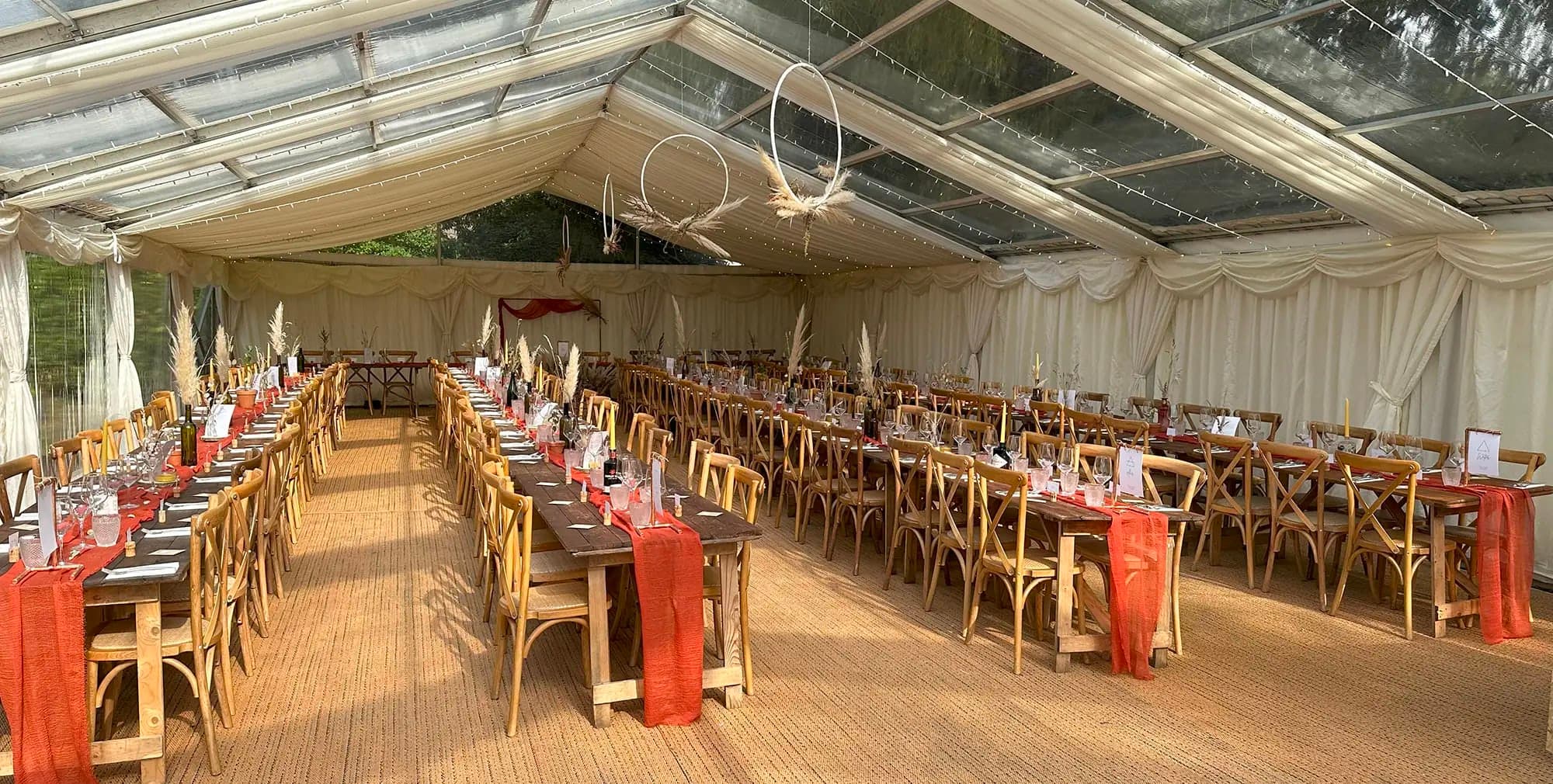Marquee event space at Nottingham Castle with banquet tables for weddings and corporate dinners.