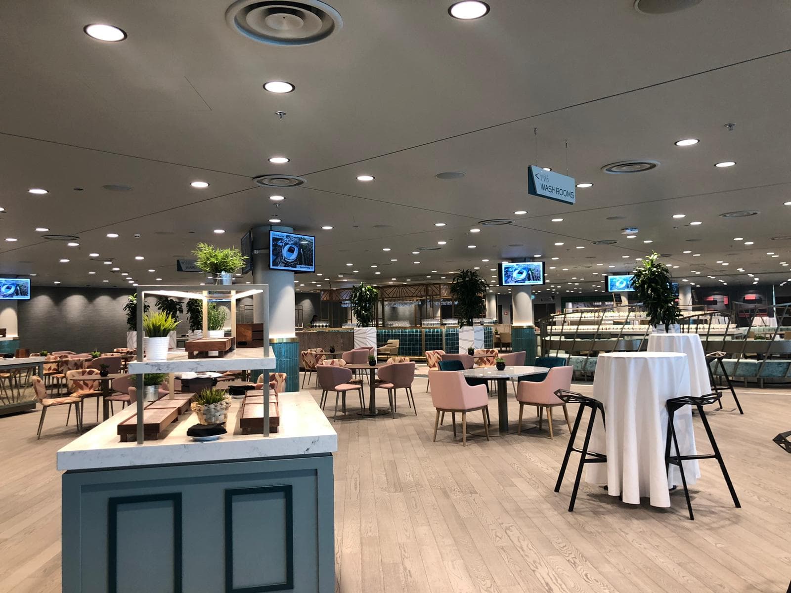 Number Nine breakout space at Wembley Stadium featuring café seating for networking events.