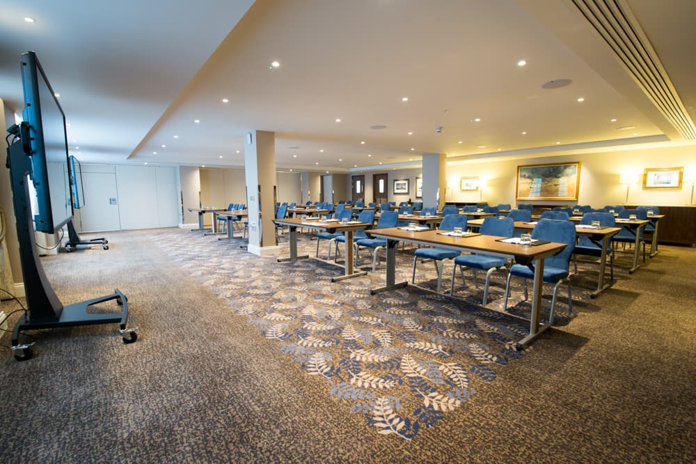 Classroom meeting room in Victory Services Club with smart board for corporate event training.