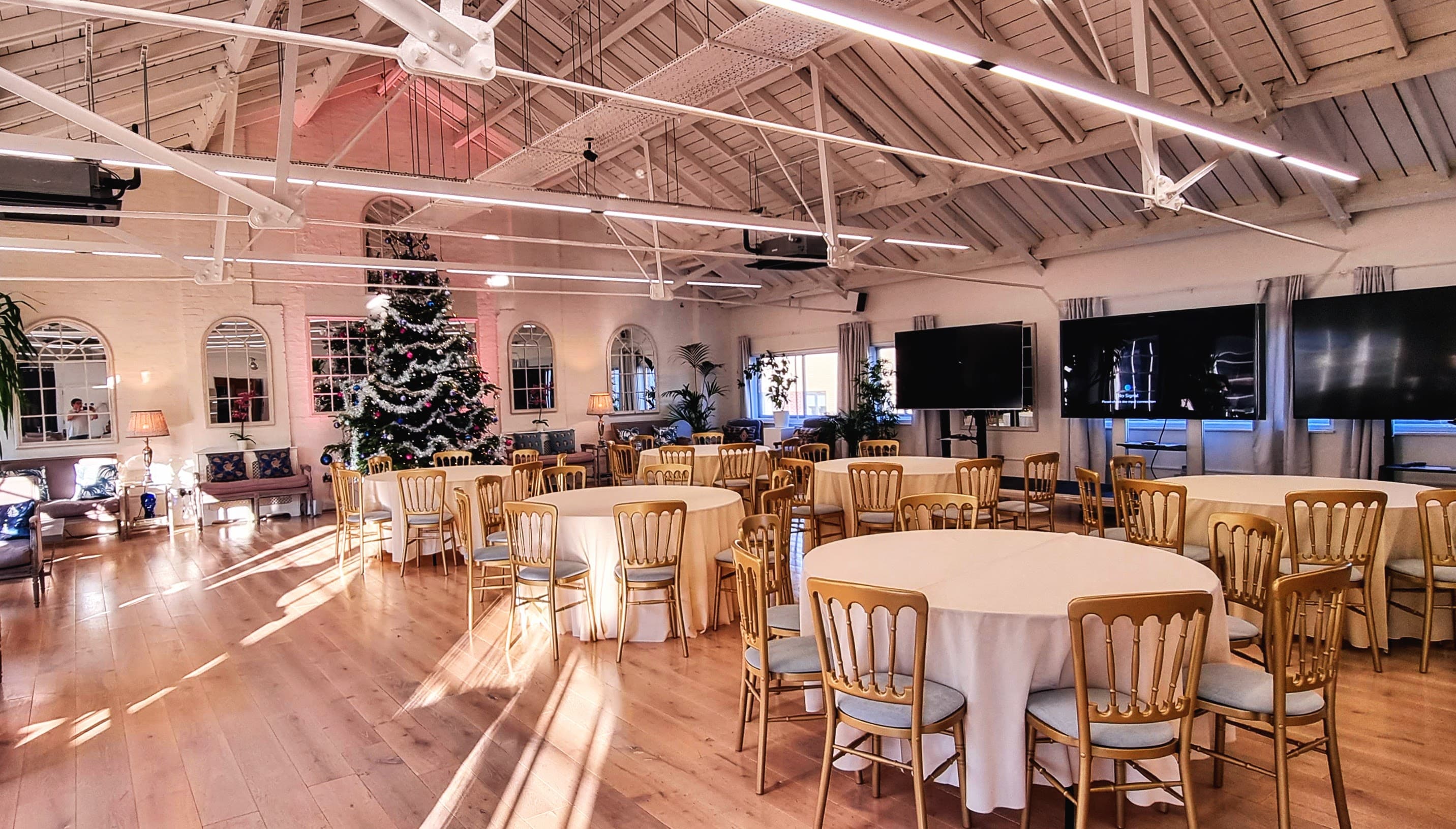 Holiday banquet setup at Lumiere Underwood featuring high ceilings for corporate or social events.
