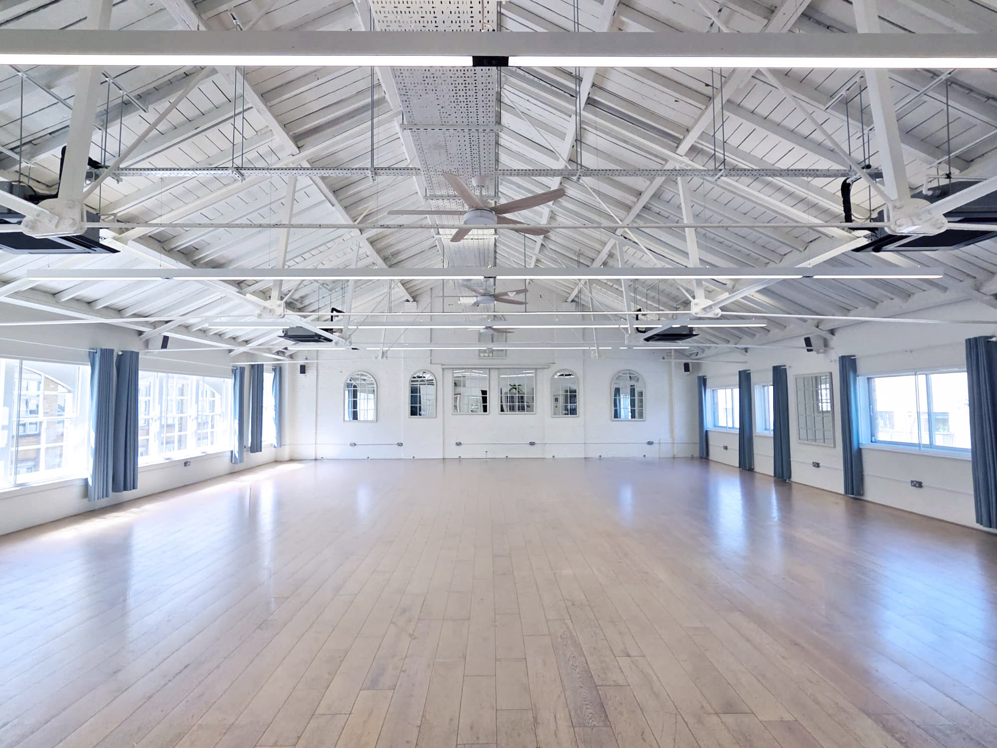 Industrial event space in Lumiere Underwood for workshops and pop-up events with neutral decor.