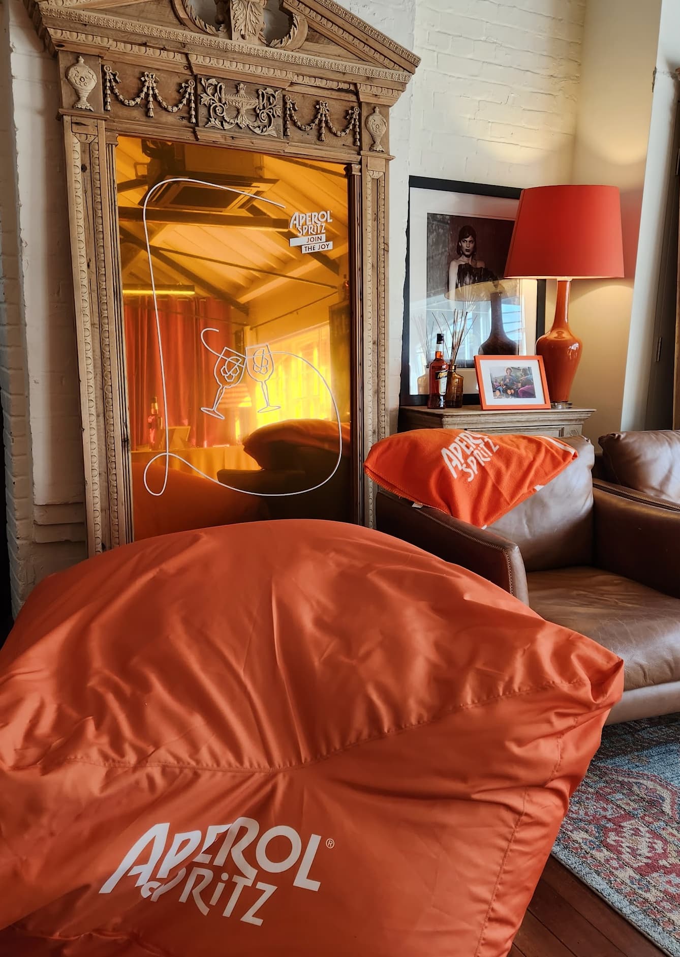 Branded lounge vignette with ambient lighting for corporate events and immersive brand activations.
