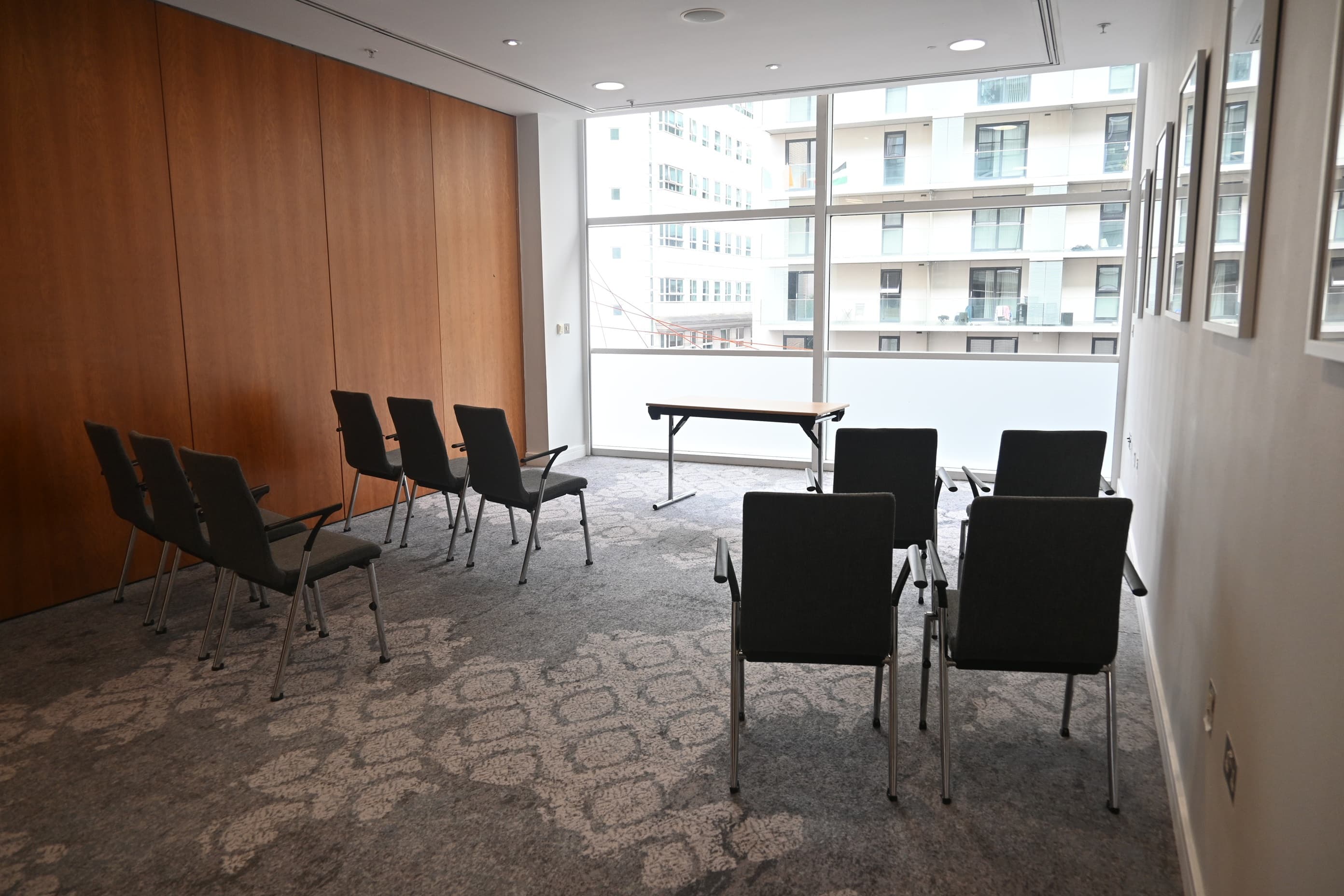 Boardroom setup in The Lowry Hotel Meeting Room 2, natural light, corporate event, small meeting.
