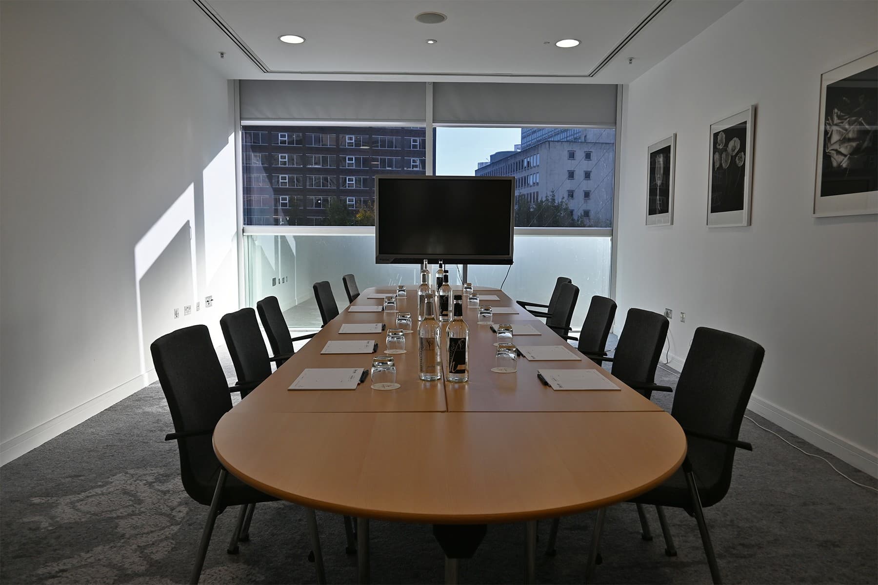 Meeting Room 6 at The Lowry Hotel: bright boardroom setup for corporate meetings and conferences.