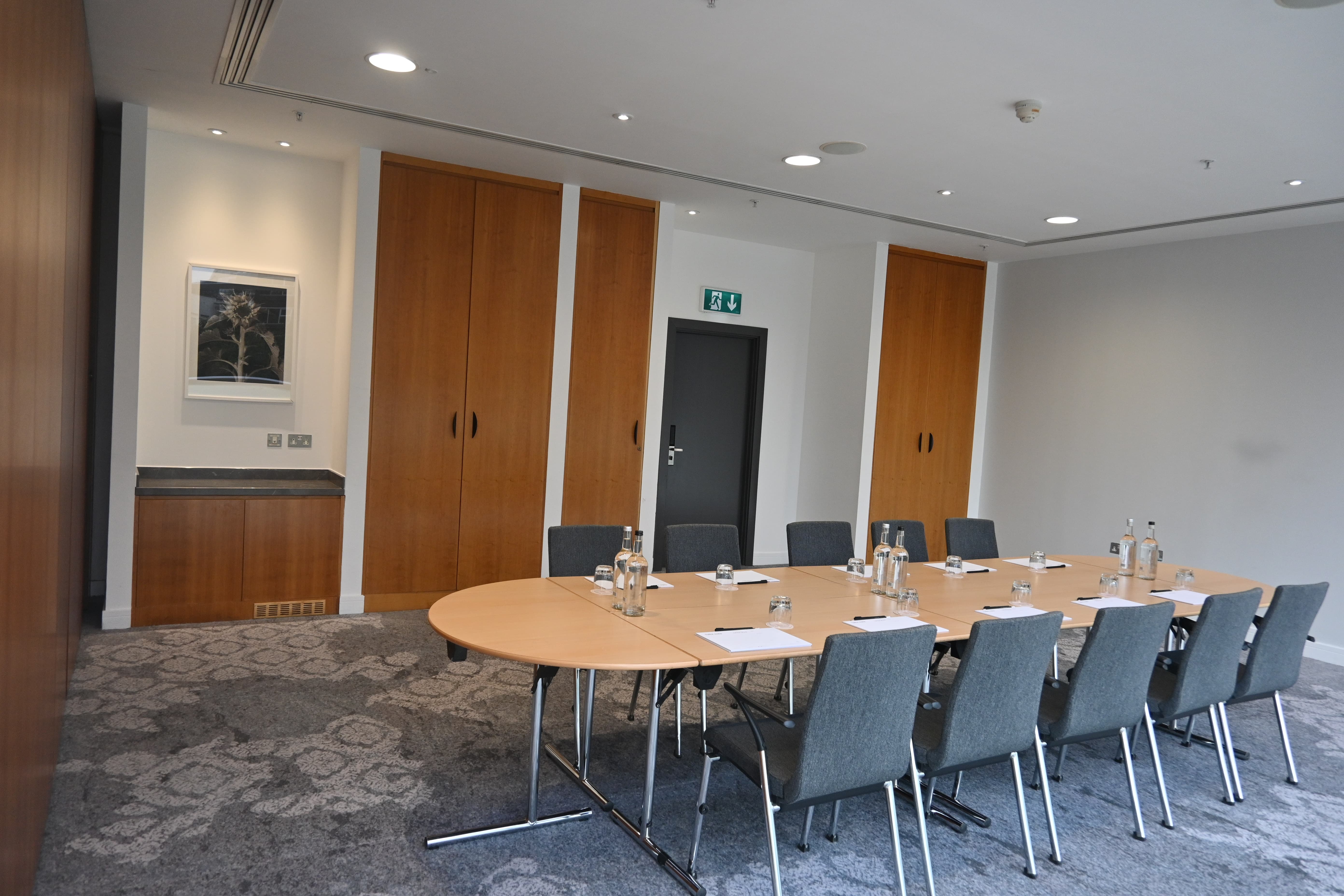 Meeting Room 7 boardroom with neutral decor for corporate offsites and strategy sessions.