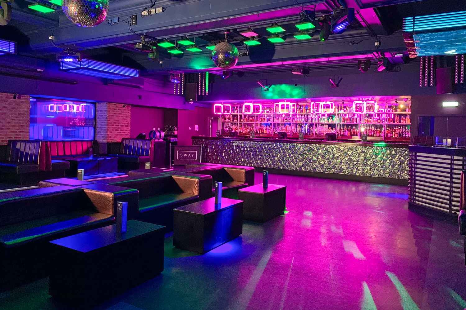 Vibrant event space in Sway with colorful lighting for nightlife gatherings.