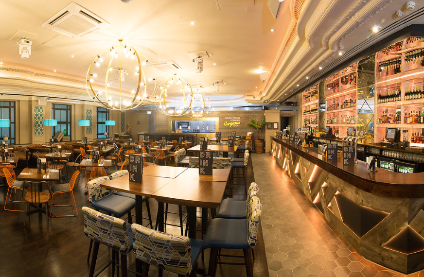 Modern event venue in Sway with stylish seating and ambient lighting for meetings.