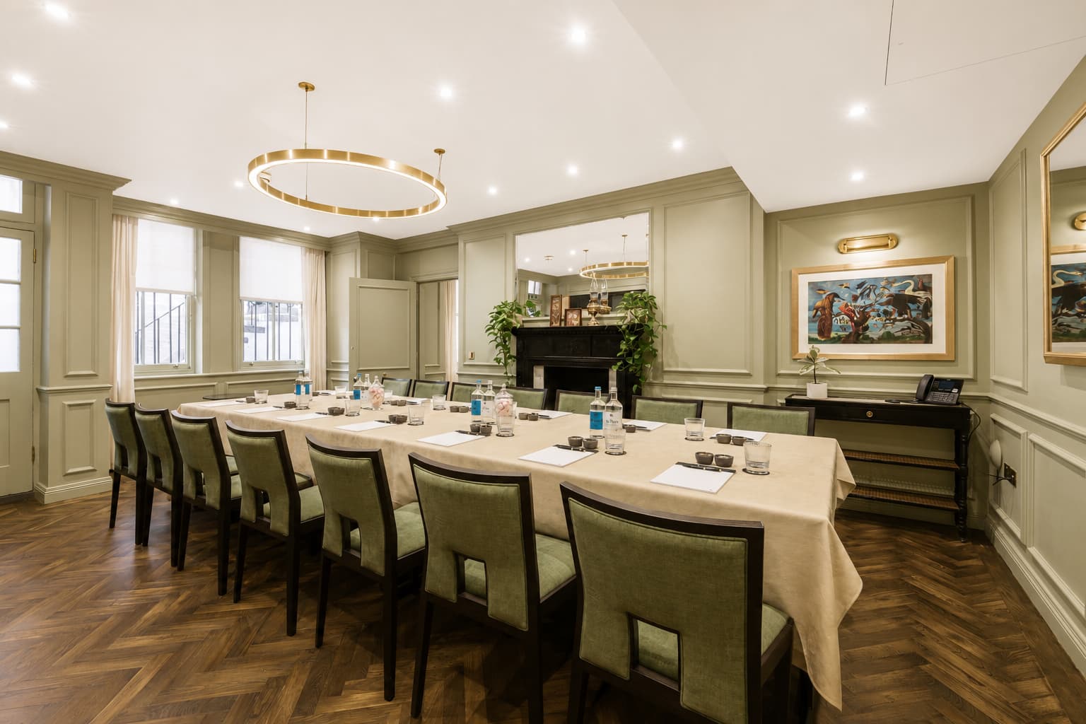 Luxury Curio Room boardroom at 11 Cadogan Gardens featuring herringbone floors for private events.