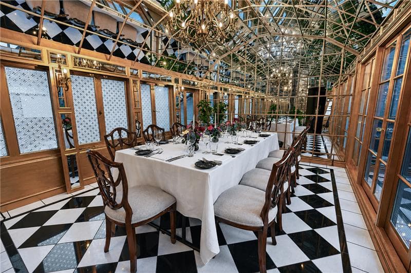 Mirror Room private dining space with glass architecture for VIP dinners and board meetings.