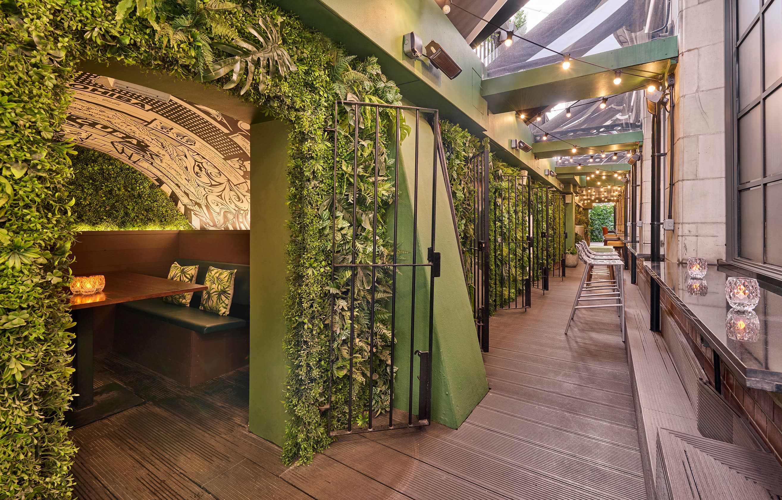 Leaf & Cane greenery-clad booths for corporate networking and small-group brainstorming events.
