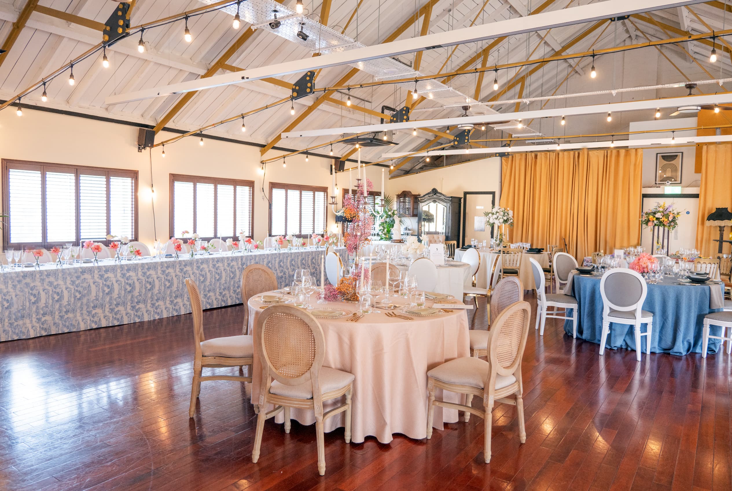 Industrial-chic banquet seating at Weddings at Underwood with bistro lighting for wedding venues.