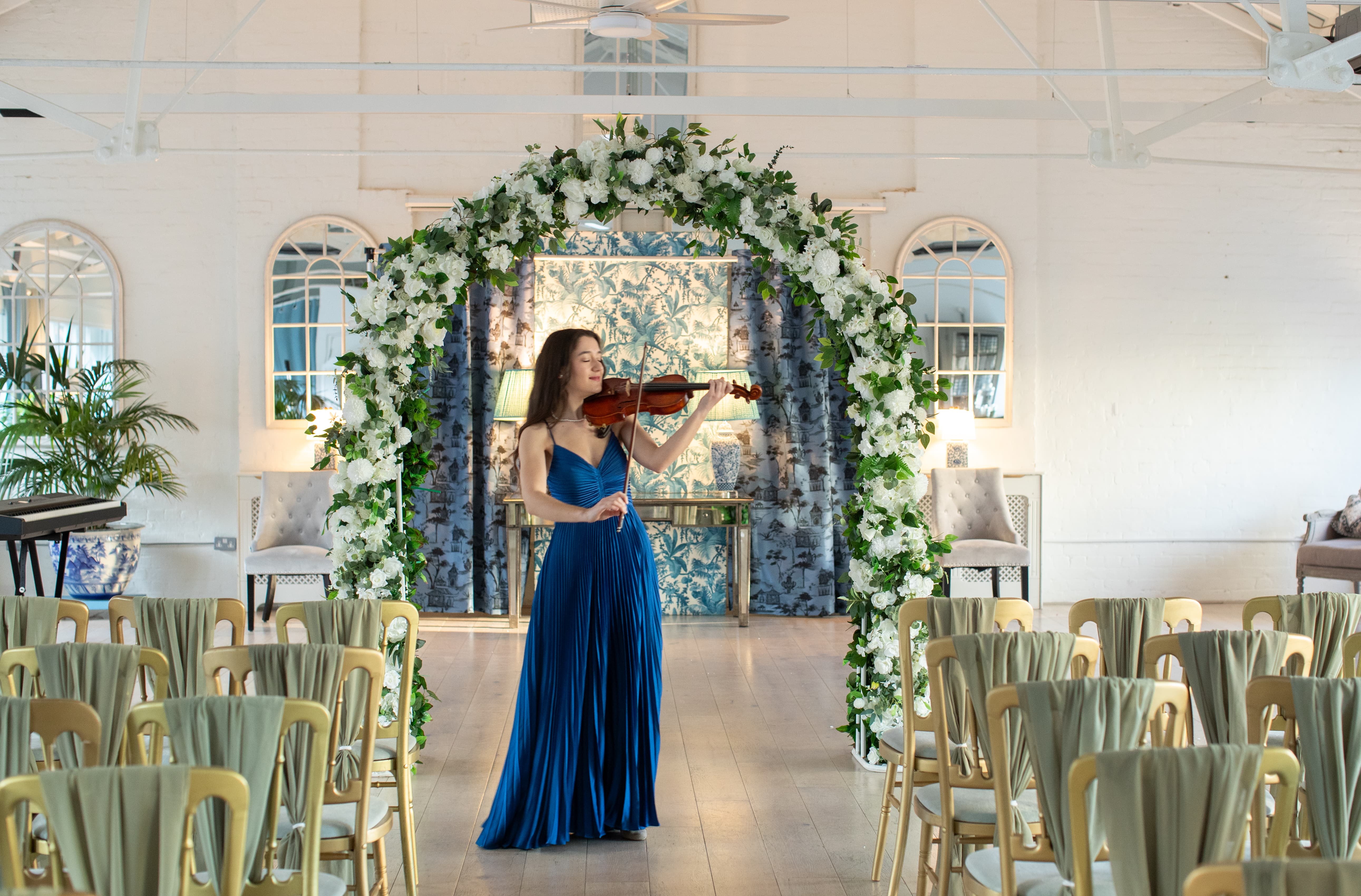 Luxury wedding venue at Underwood with floor-to-ceiling floral arch for elegant ceremonies.