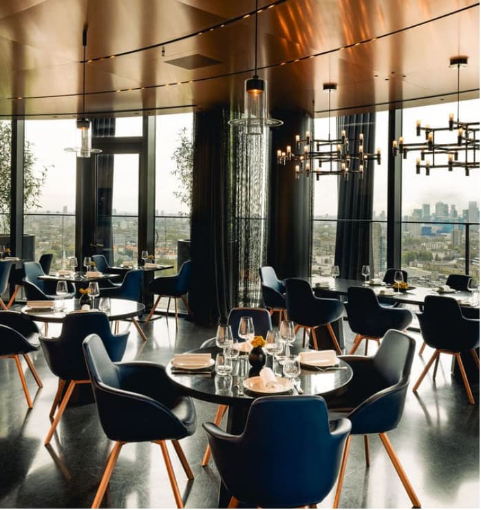 Modern private dining space with city views for corporate networking and executive board dinners.
