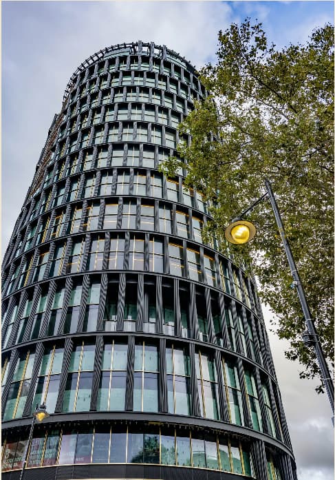 Art'otel London Hoxton skyscraper: modern curved facade for corporate meetings and executive events.
